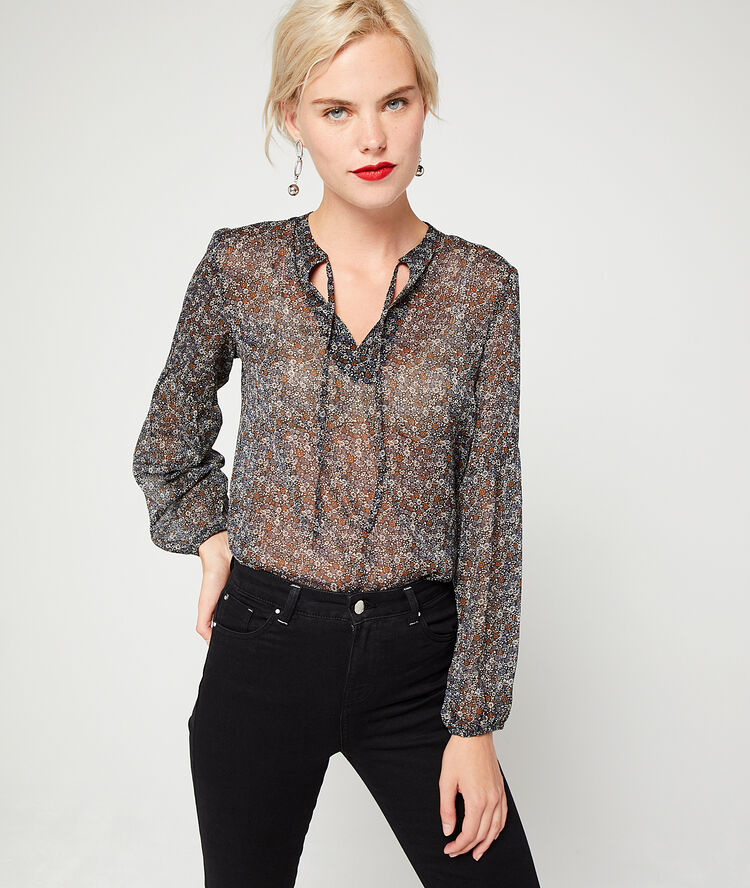 Blusa floral efecto transparente azul marino.