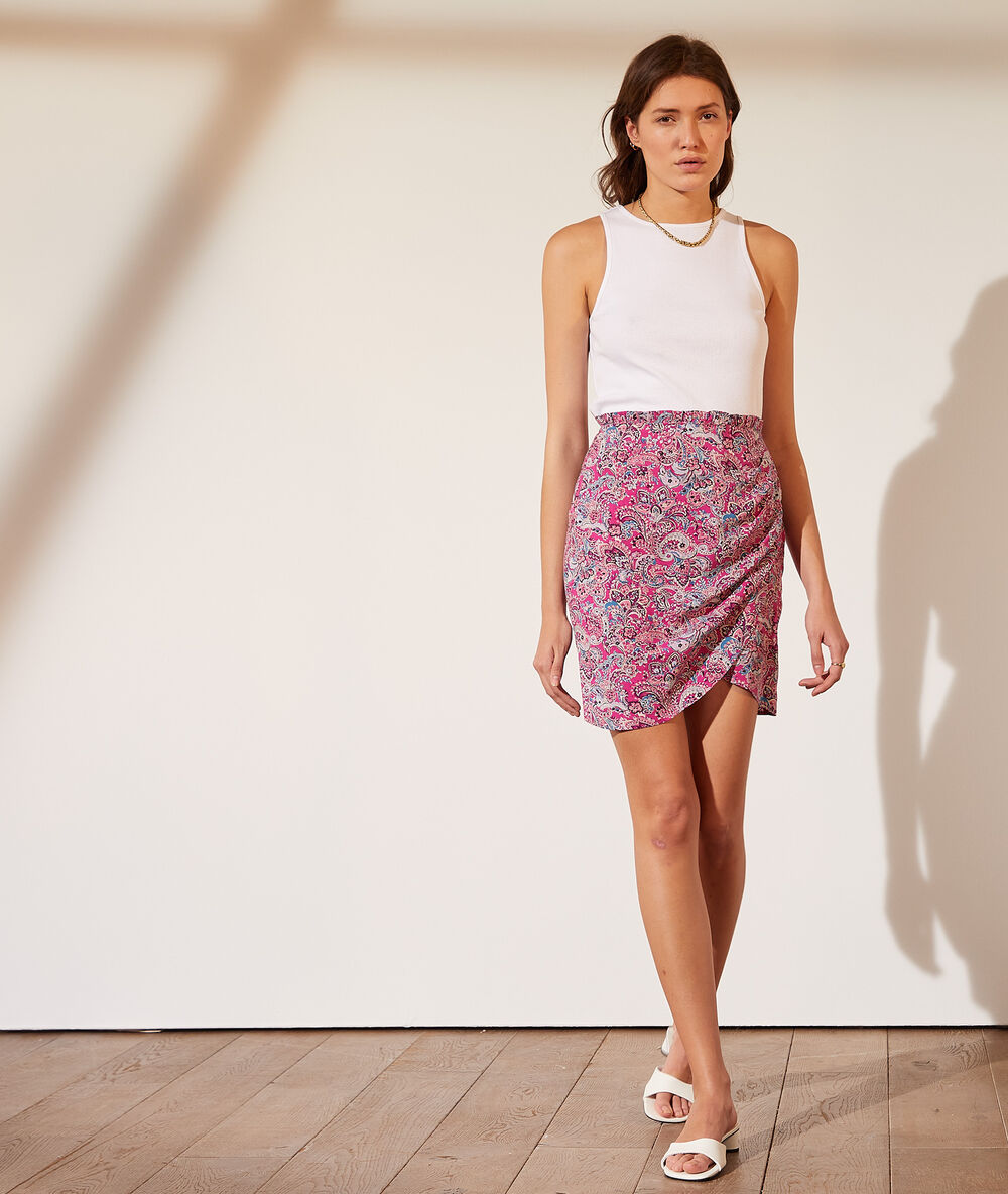 Falda drapeada estampado floral fucsia.