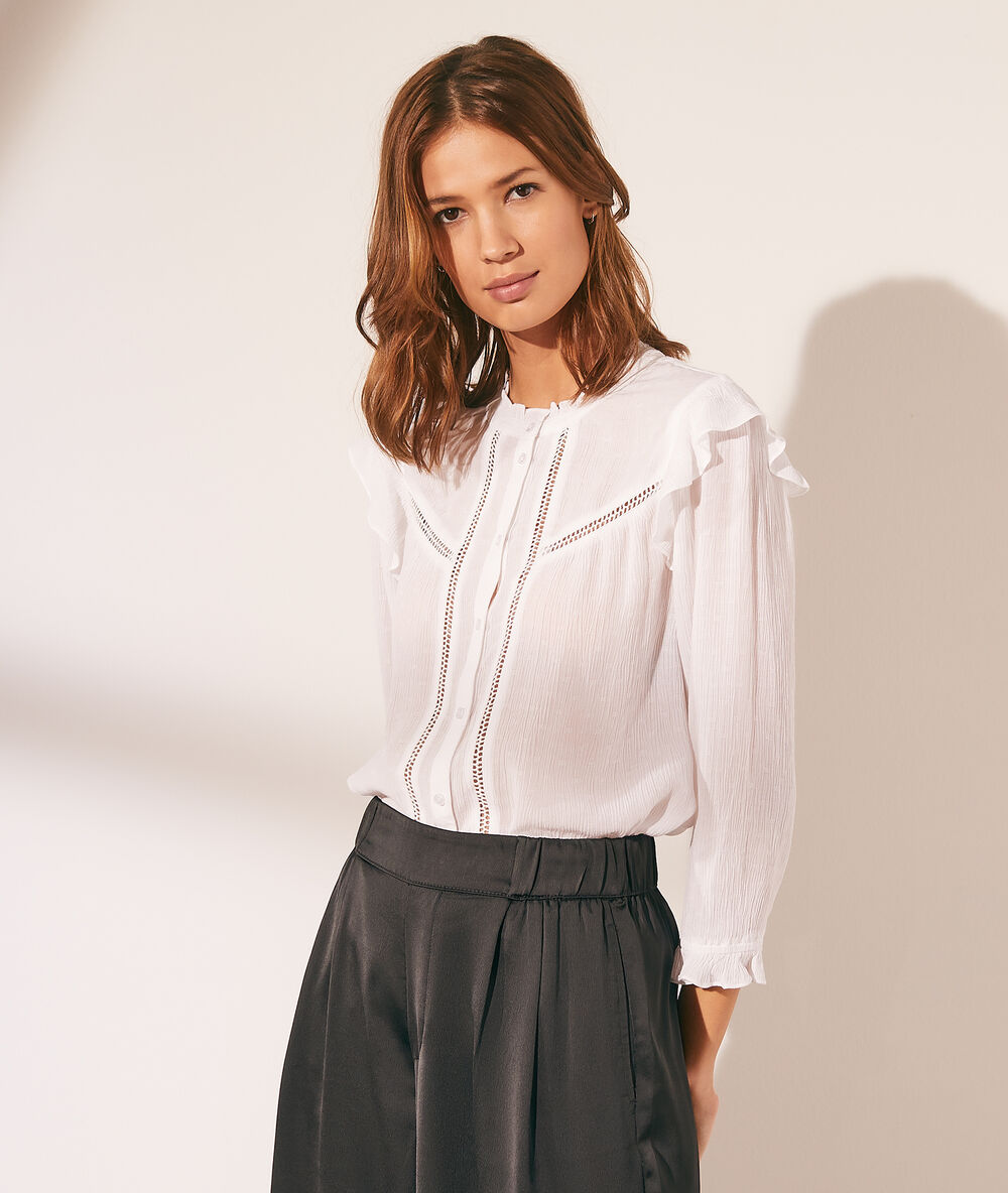 Camisa con volantes crudo.