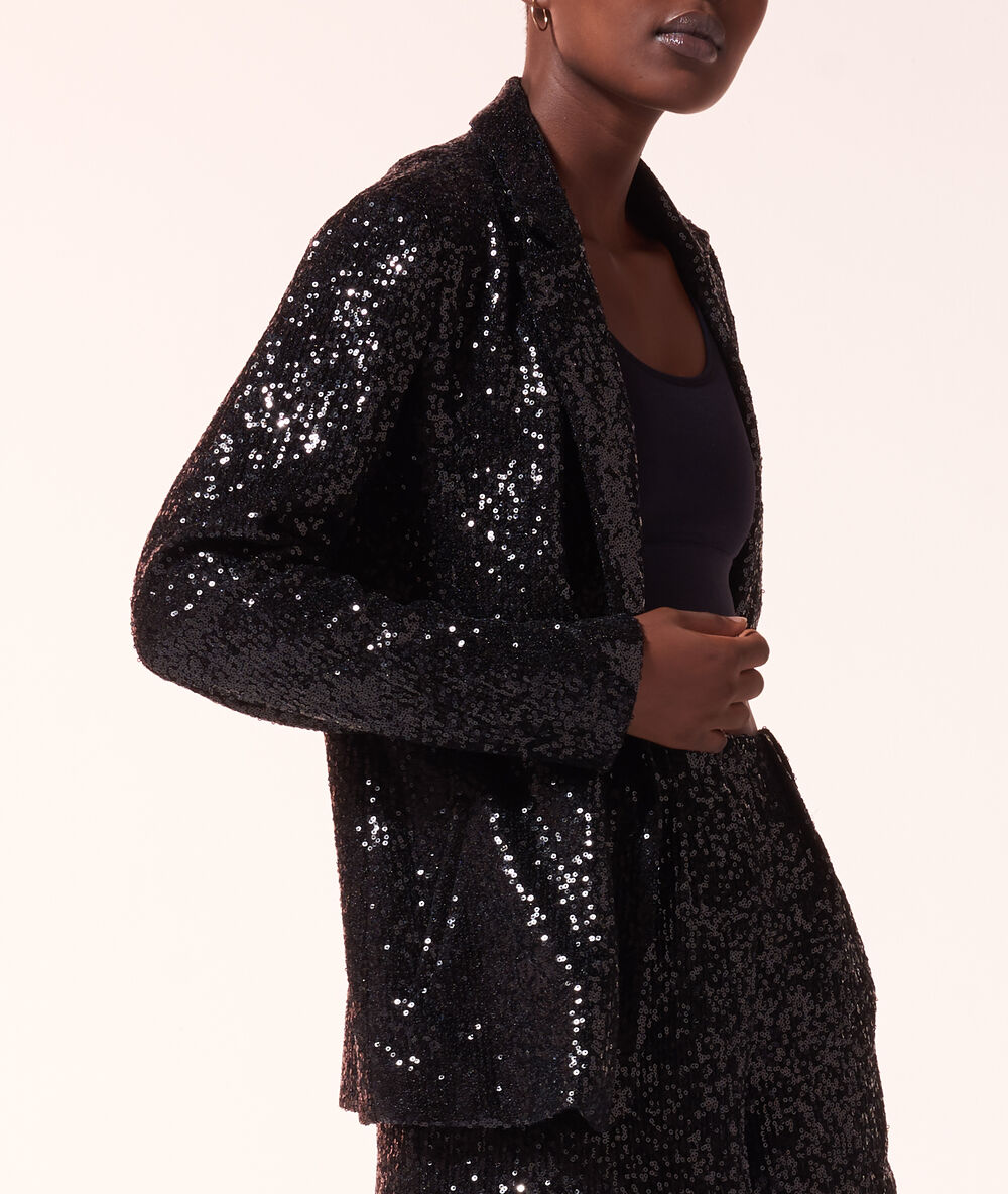 Americana con lentejuelas negro.