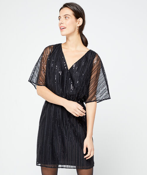 Vestido cruzado de lentejuelas negro.