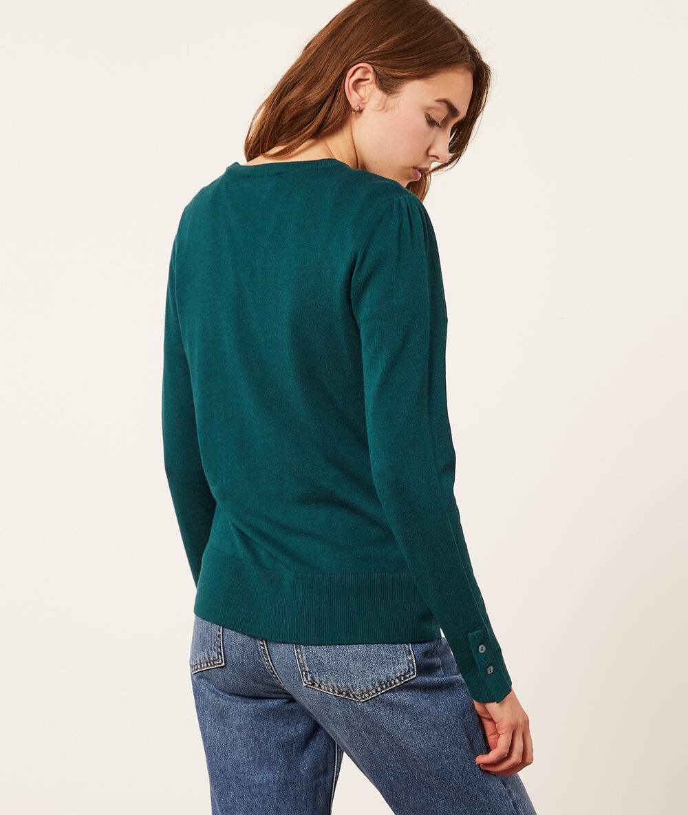 Jersey de punto fino verde.