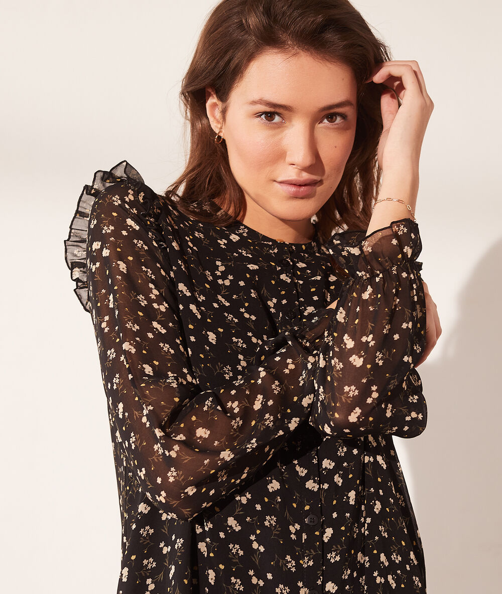 Vestido vaporoso estampado floral negro.