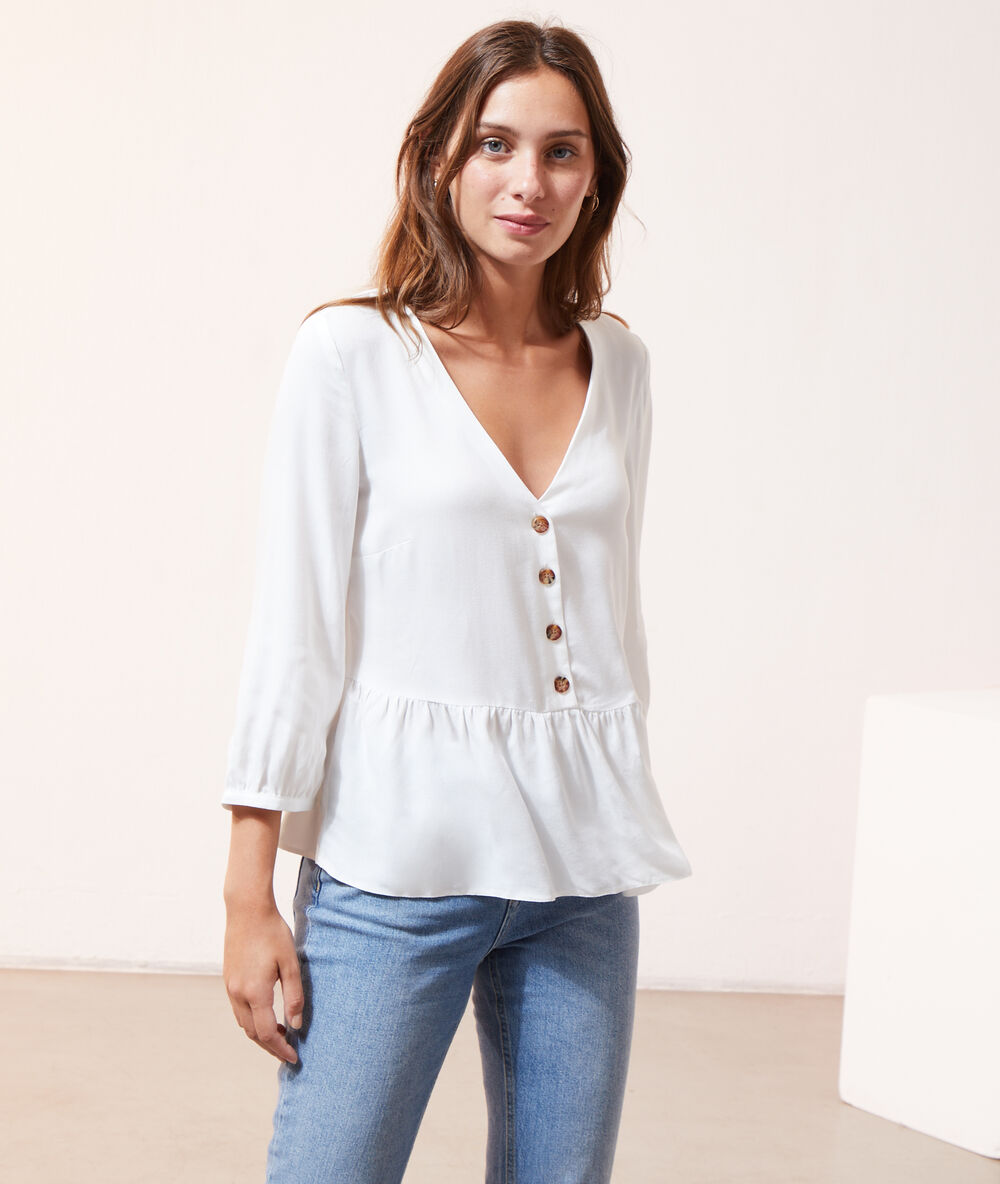 Blusa con volantes y botones crudo.