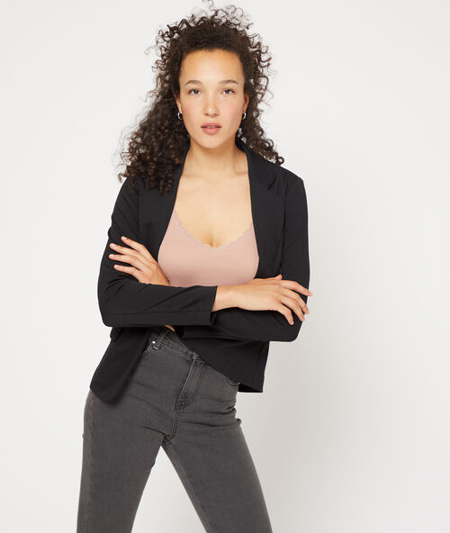 Camiseta de tirantes acanalada con remate de encaje rosa.