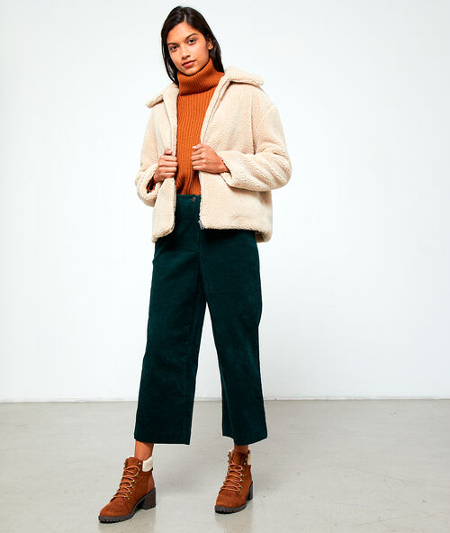 Blouson effet peau lainée beige rose.