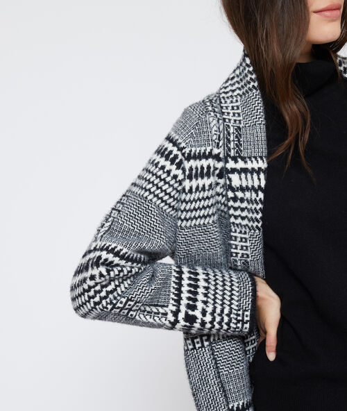 Chaqueta larga con estampado jacquard negro.