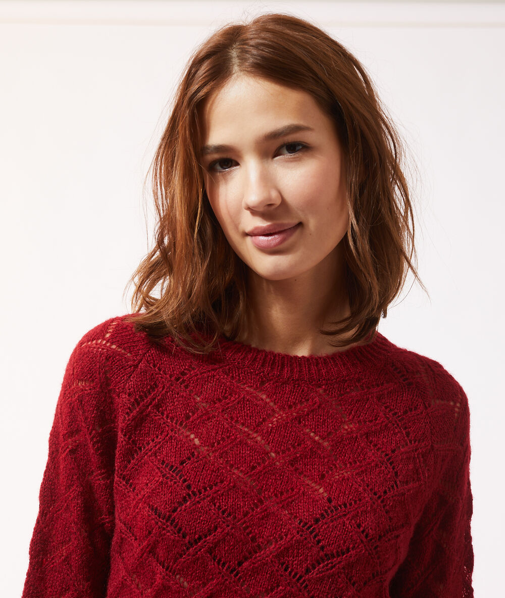 Pull maille pointelle rouge.