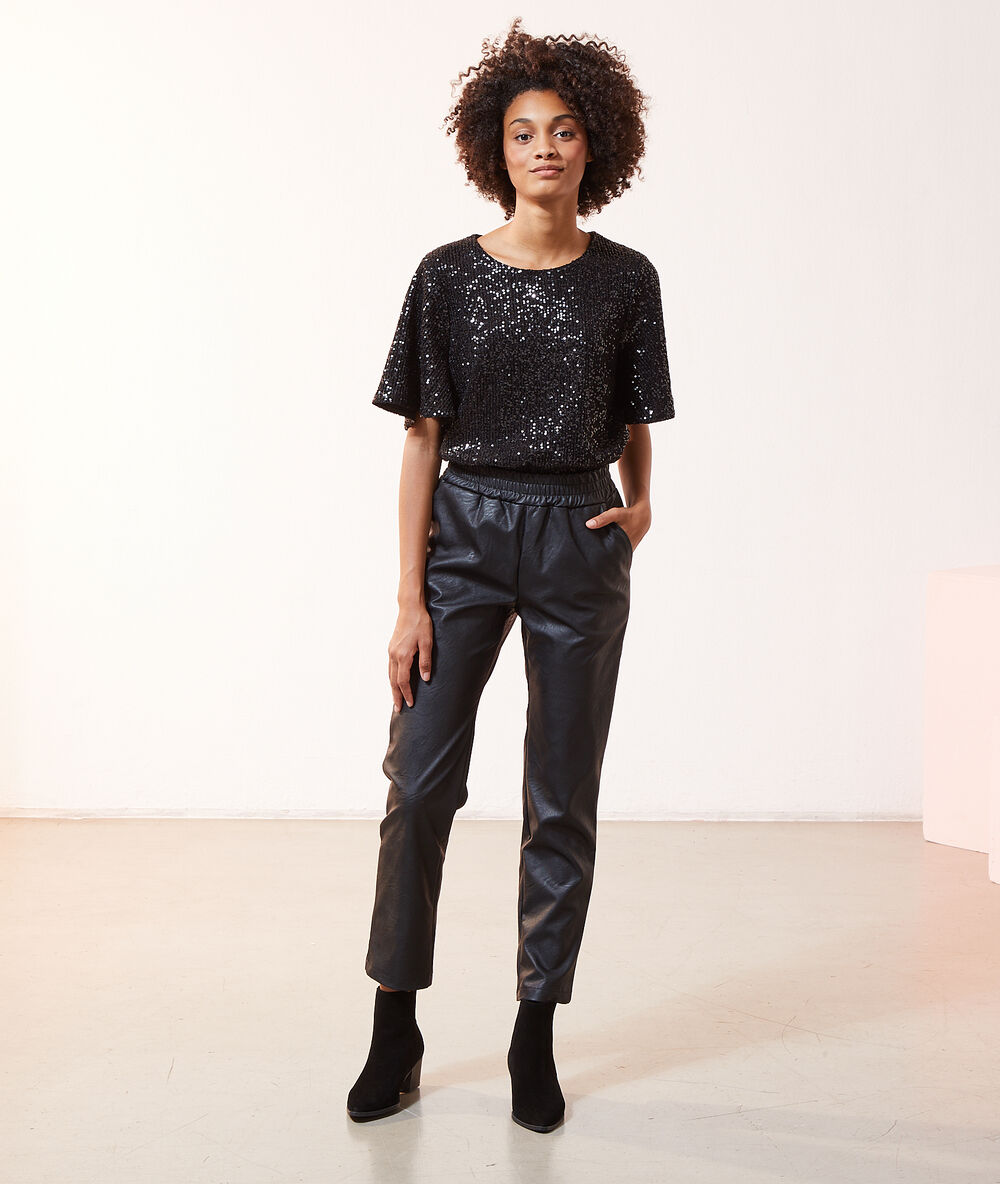 Blouse à sequins, manches volants noir.