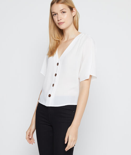 Blusa cuello en v abotonada crudo.