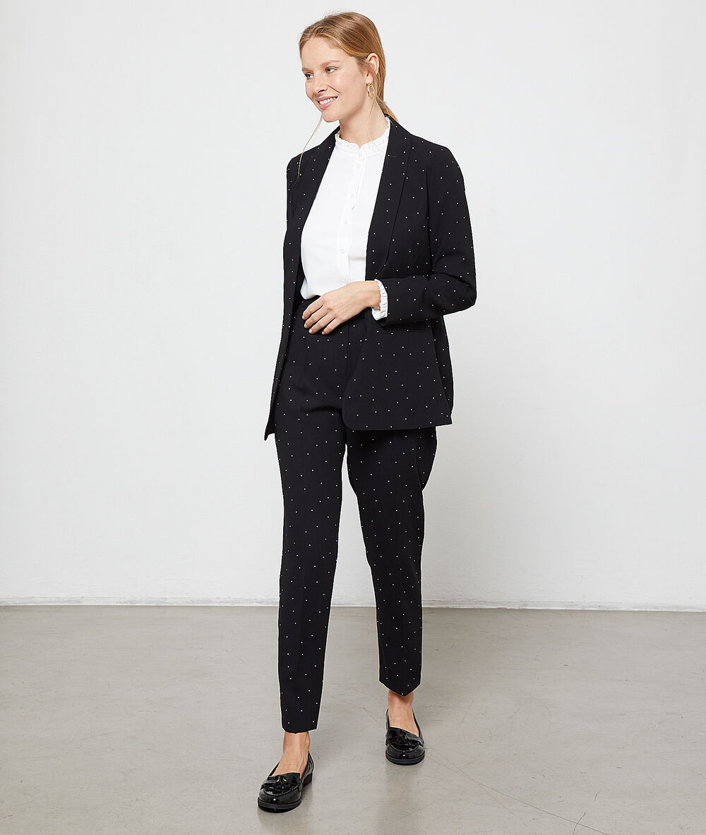 Pantalón de talle alto de lunares negro.