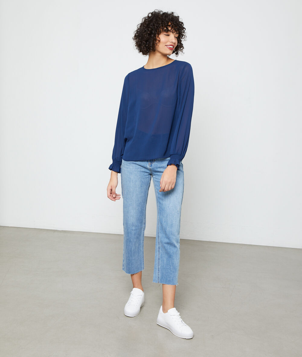Blusa abotonada a la espalda azul marino.
