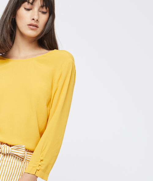 Blusa espalda escotada con volantes c.curry.