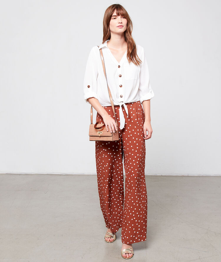 Blusa de botones tipo ámbar blanco.