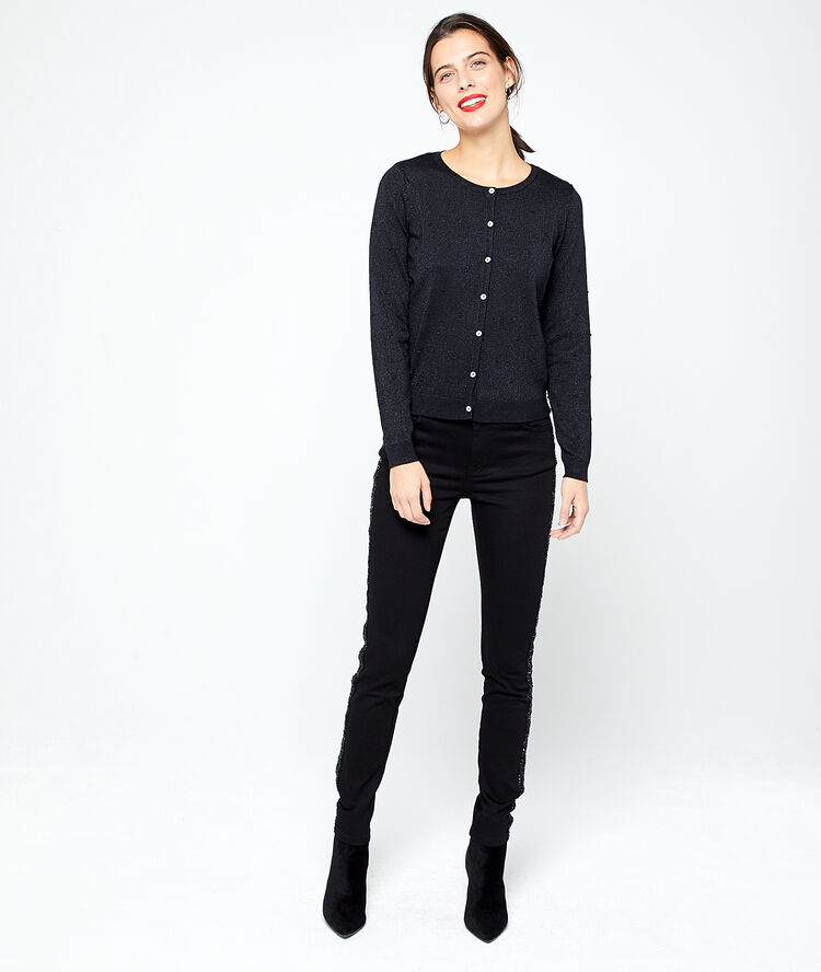 Pantalón ajustado con bordes metalizados negro.