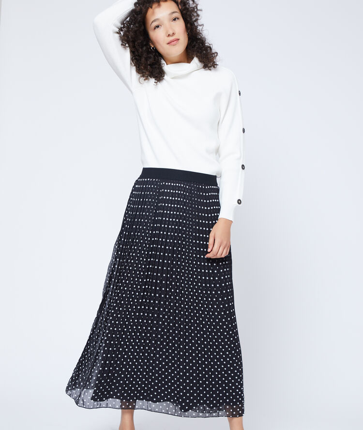 Falda plisada de lunares negro.
