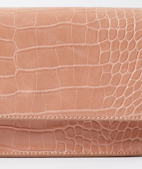Bolso de mano efecto cocodrilo maquillaje.