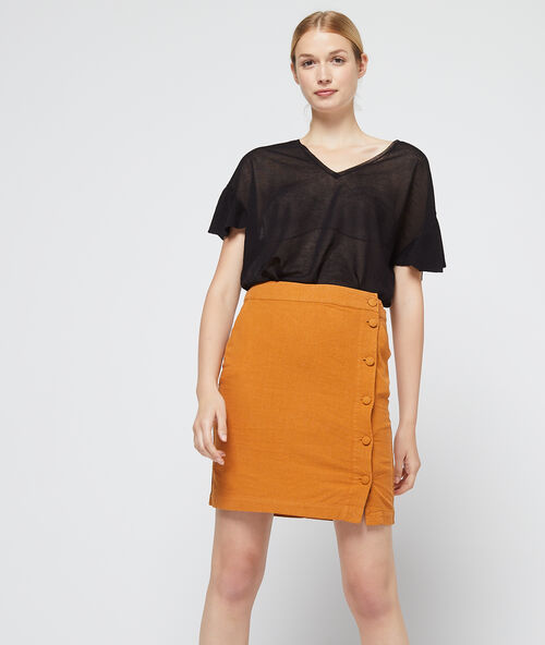 Camiseta efecto transparente de punto fino negro.