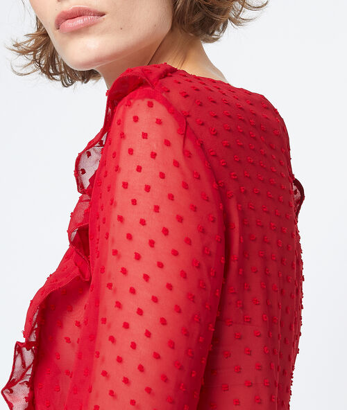 Blusa transparente de plumetis rojo.