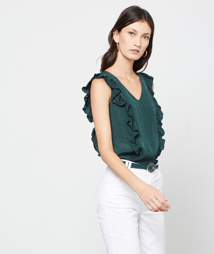 Blusa plumetis con volantes verde.