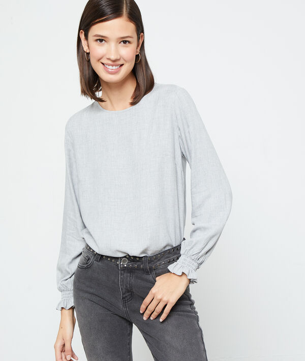 Blusa con la espalda abotonada Blusa con la espalda abotonada