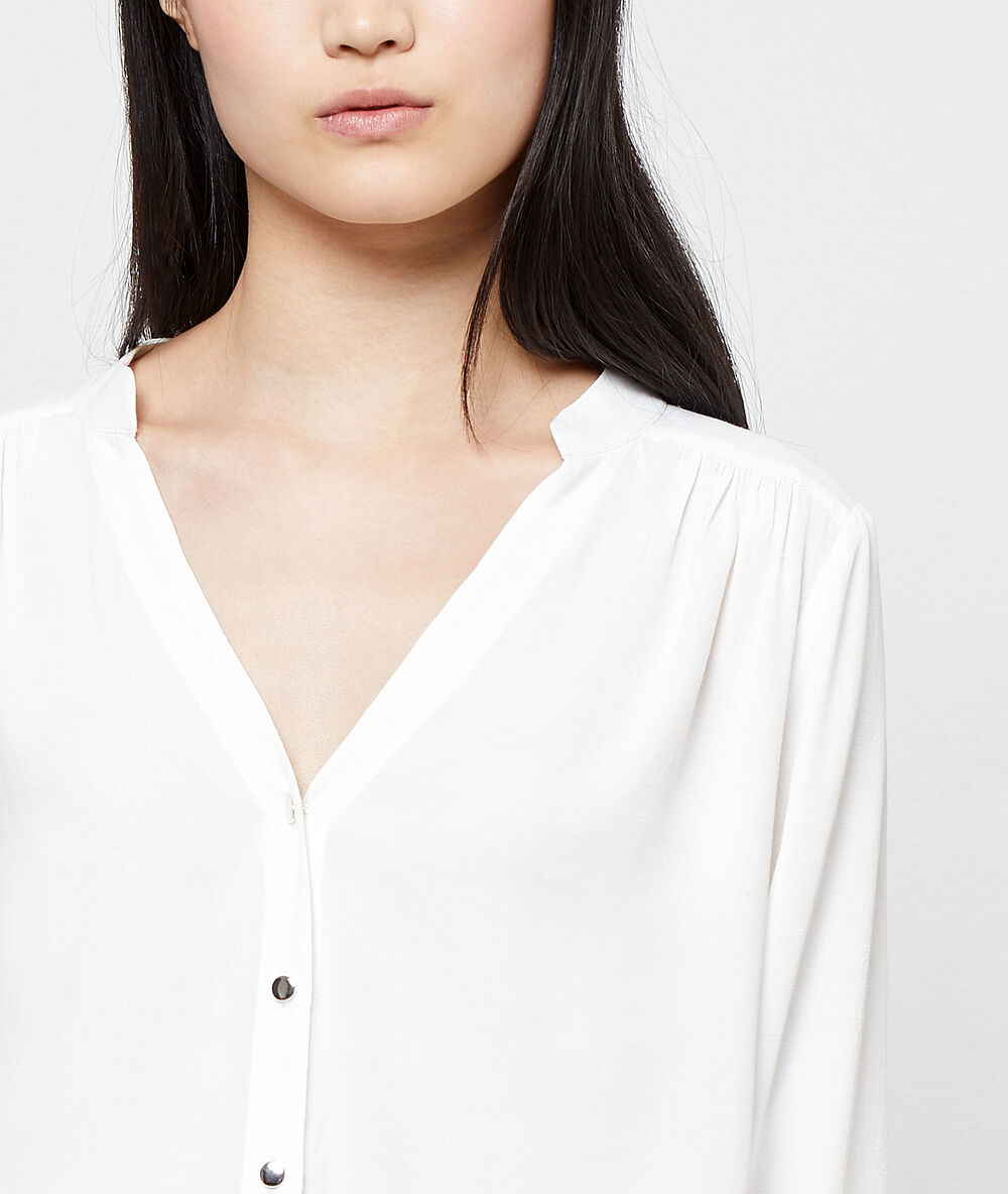 Blusa abotonada crudo.