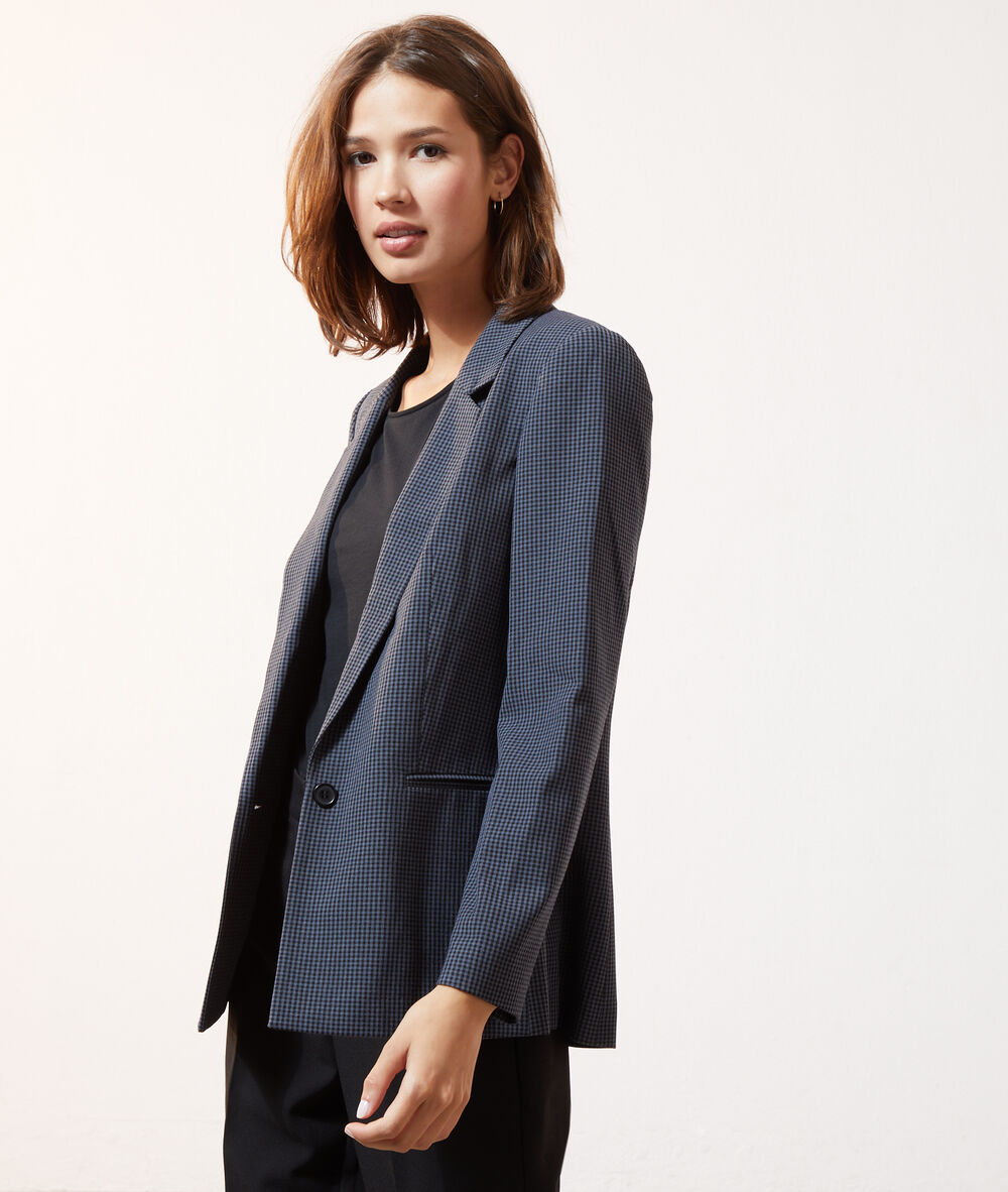 Veste de tailleur à carreaux noir.