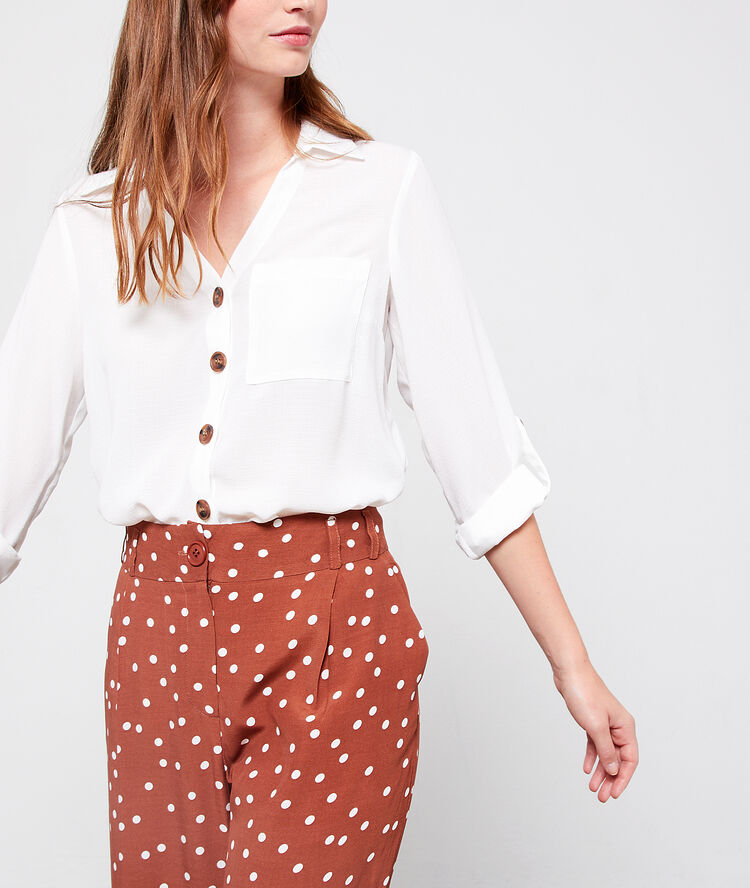 Blusa de botones tipo ámbar blanco.