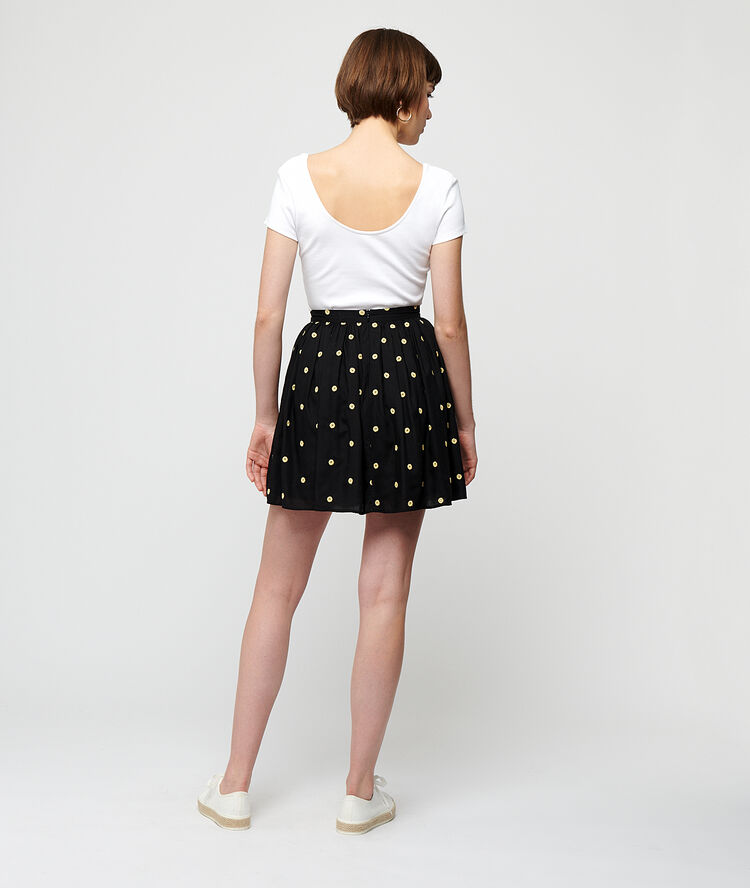 Falda patinadora estampado topos negro.