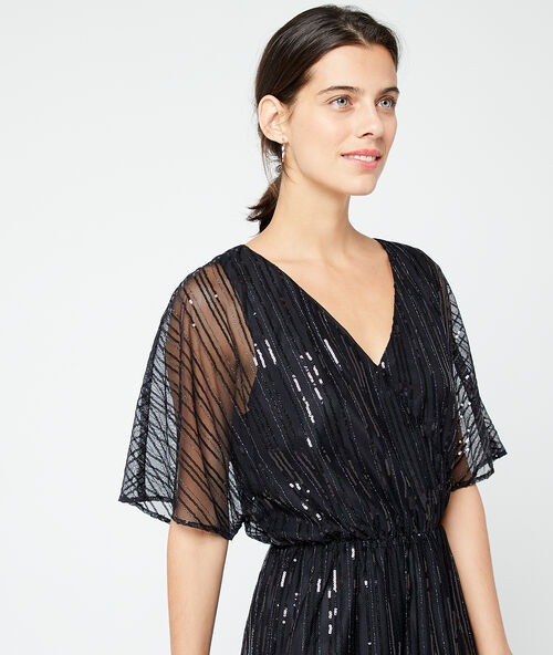 Vestido cruzado de lentejuelas negro.