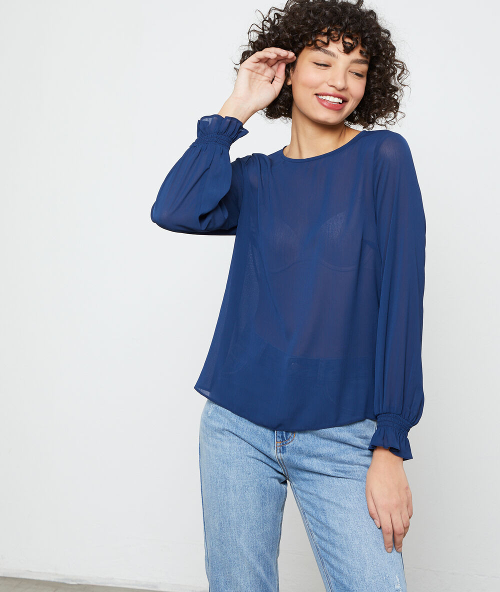 Blusa abotonada a la espalda azul marino.
