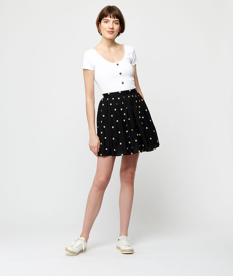 Falda patinadora estampado topos negro.