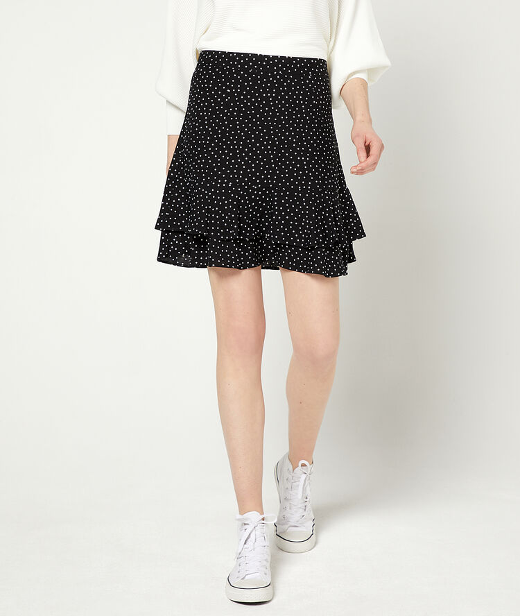 Falda patinadora de lunares negro.