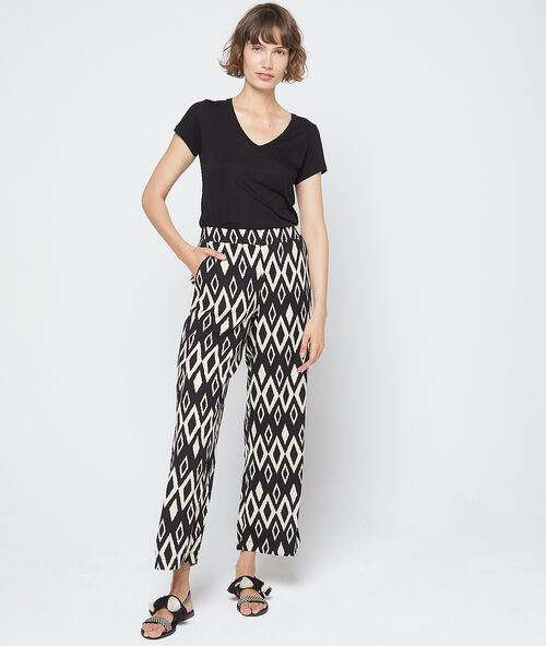 Pantalón estampado gráfico crudo.