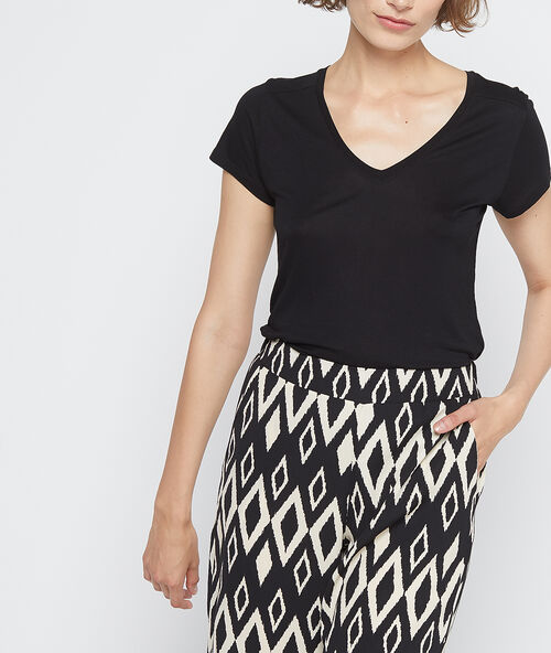 Pantalón estampado gráfico crudo.