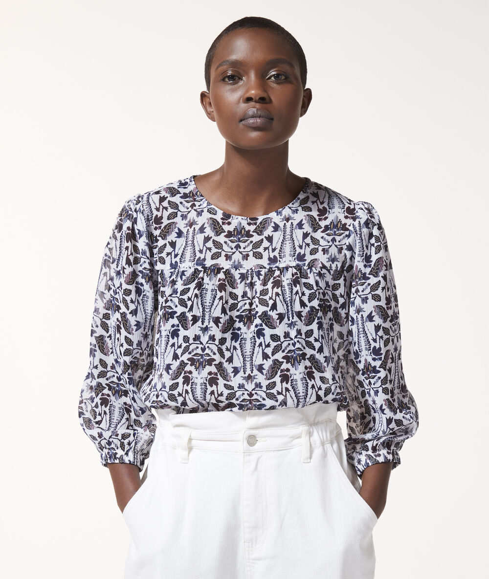 Blusa de cuello redondo con estampado floral ecru.