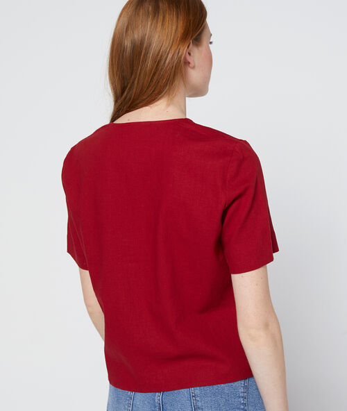 Blouse corta abotonada asimétrica granate.