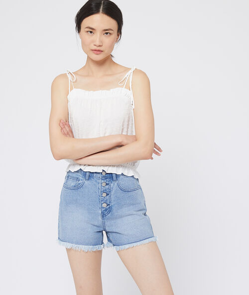 Top de plumetis crudo.