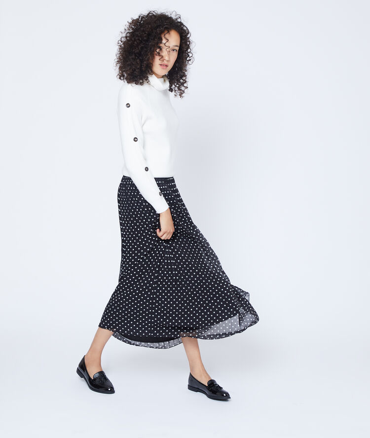 Falda plisada de lunares negro.