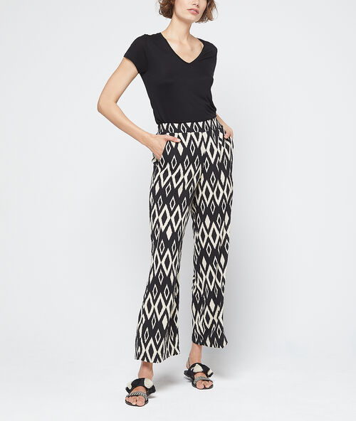 Pantalón estampado gráfico crudo.