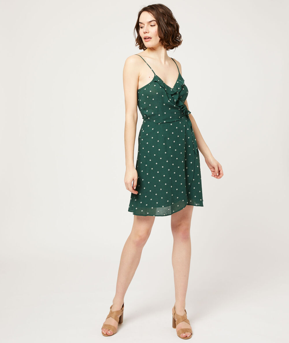 Vestido escote cruzado, estampado de lunares turquesa.