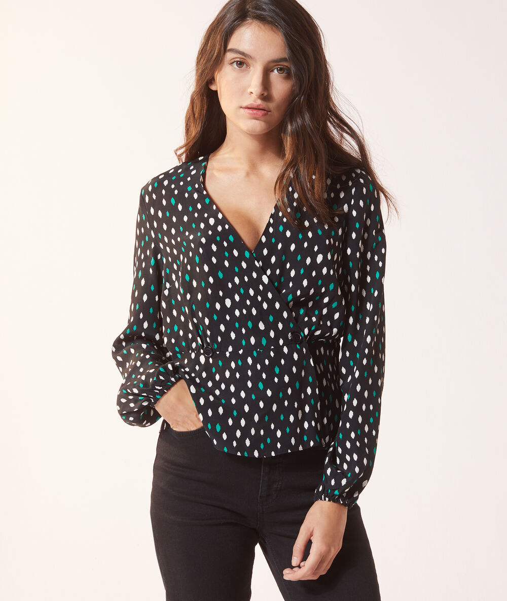 Blouse cache-cœur noir.
