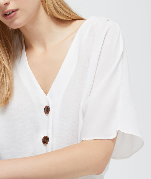 Blusa cuello en v abotonada crudo.