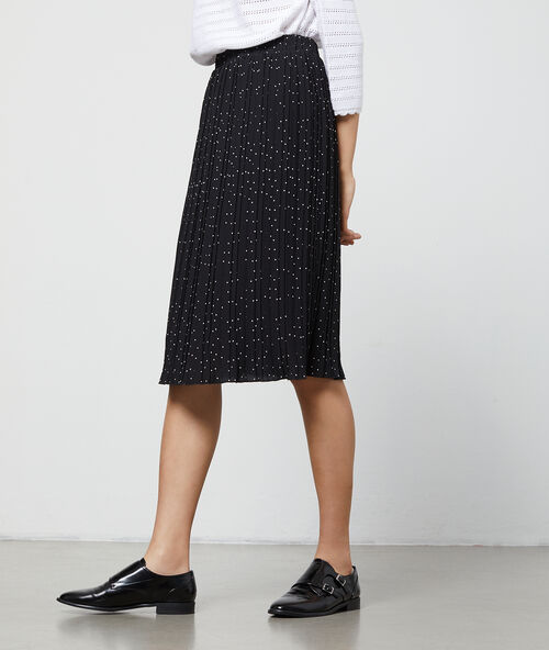 Falda midi plisada estampado de lunares negro.