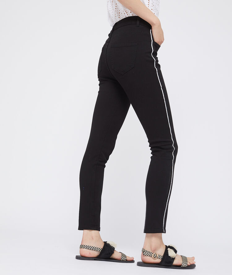 Pantalón ajustado con franjas laterales negro.