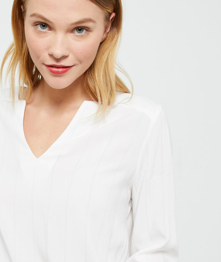 Blusa a rayas crudo.