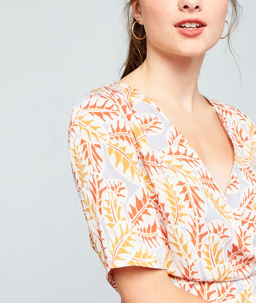 Blusa cruzada anudada crudo.