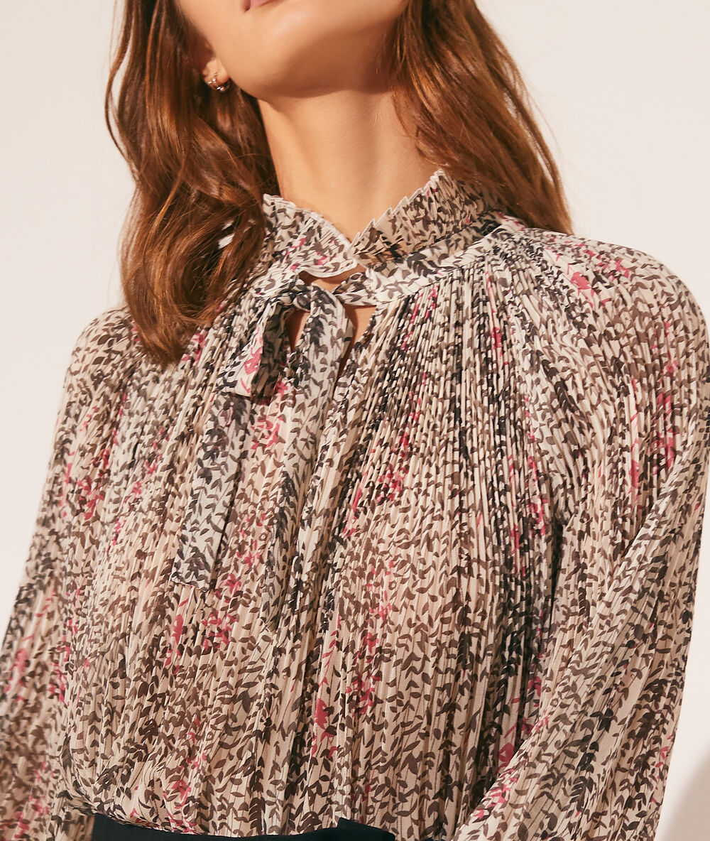 Blusa estampado floral crudo.