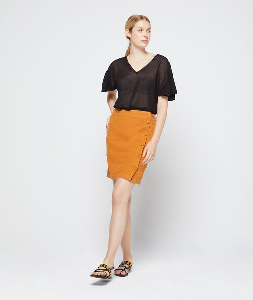 Camiseta efecto transparente de punto fino negro.