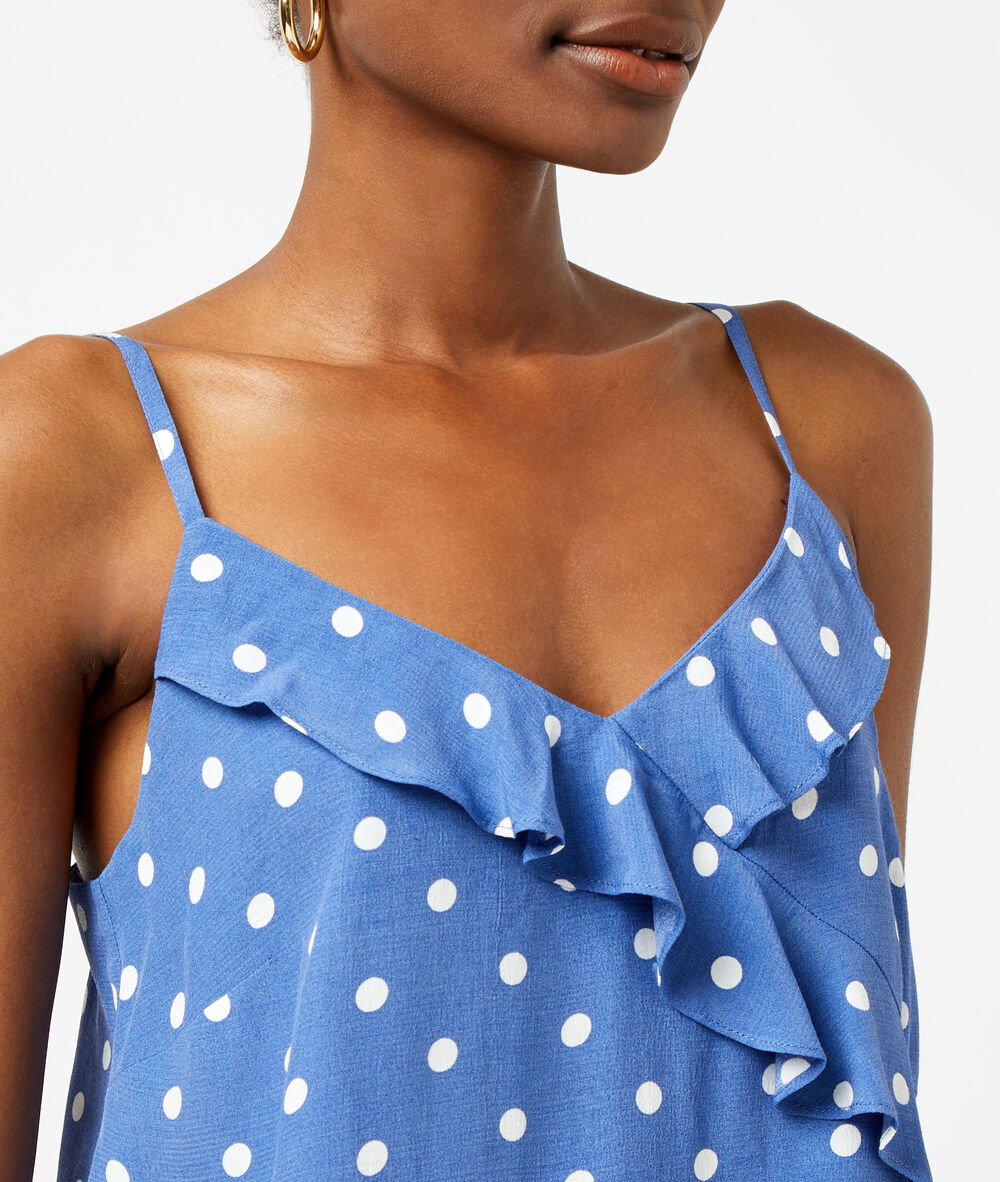 Top estampado de lunares azul.